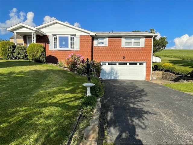 view of front of home with a garage and a front yard