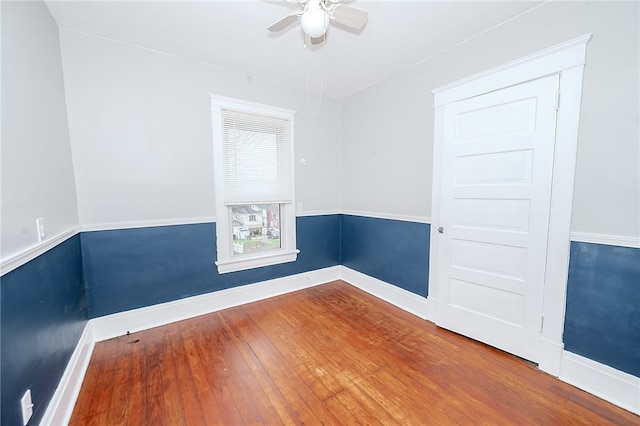 empty room with wood-type flooring and ceiling fan