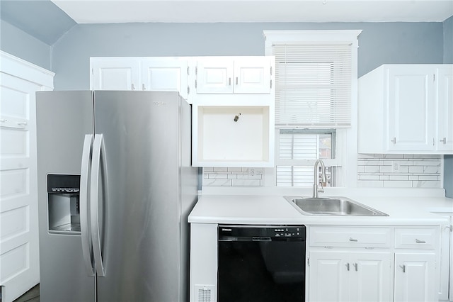 kitchen with stainless steel fridge with ice dispenser, black dishwasher, white cabinetry, and sink