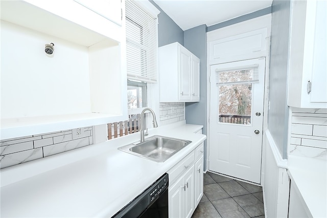 kitchen featuring backsplash, white cabinetry, sink, and dark tile patterned flooring