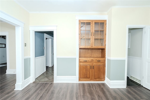 interior space with crown molding and dark wood-type flooring