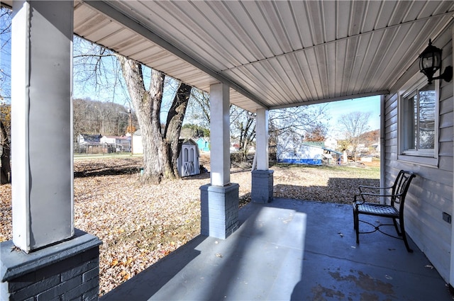 view of patio with a shed