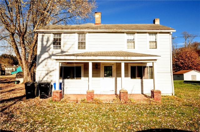 view of front facade with a porch and a front lawn