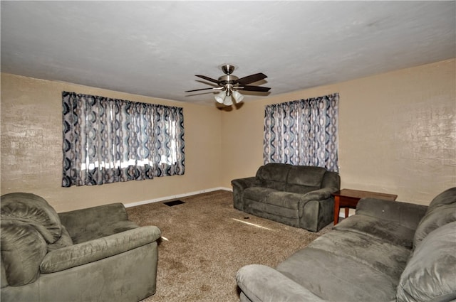 living room with ceiling fan and carpet floors