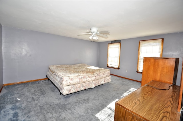 bedroom with ceiling fan and light colored carpet