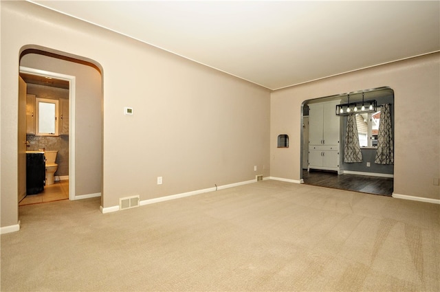 unfurnished room with carpet flooring