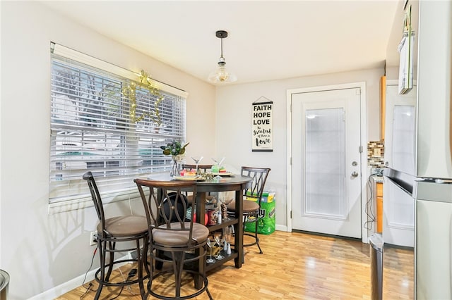 dining area with light hardwood / wood-style flooring