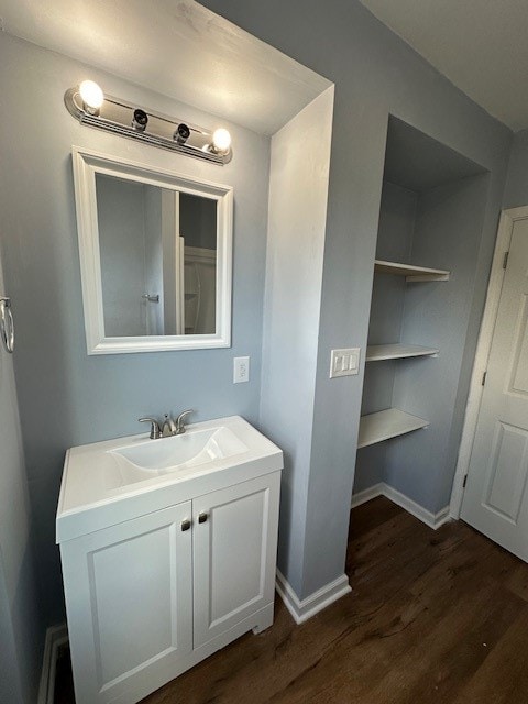 bathroom featuring vanity and hardwood / wood-style flooring