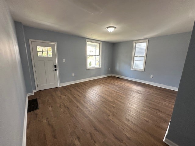 foyer with dark hardwood / wood-style flooring