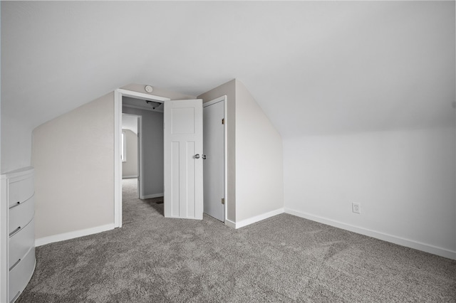 bonus room featuring carpet flooring and lofted ceiling