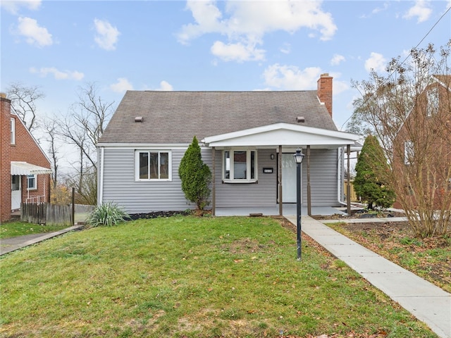 view of front of house featuring a front lawn and a porch