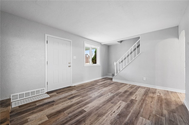 foyer with dark hardwood / wood-style flooring