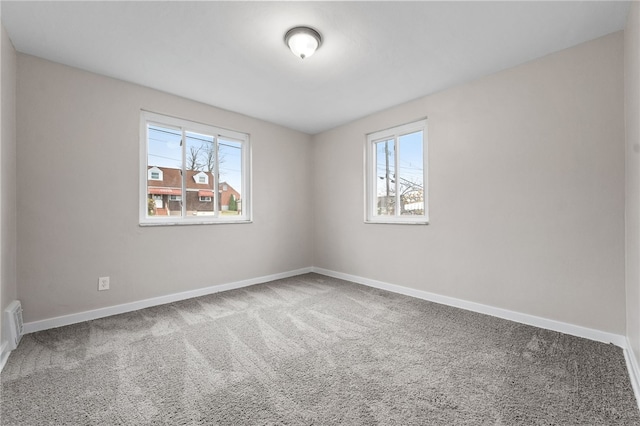 spare room featuring carpet floors