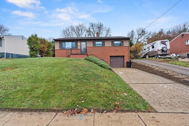 view of front of property featuring a garage and a front lawn