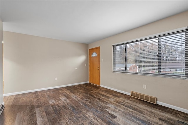 foyer entrance featuring dark hardwood / wood-style floors