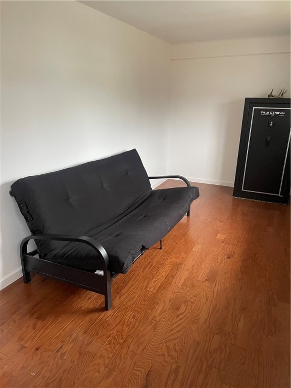 living area with hardwood / wood-style flooring