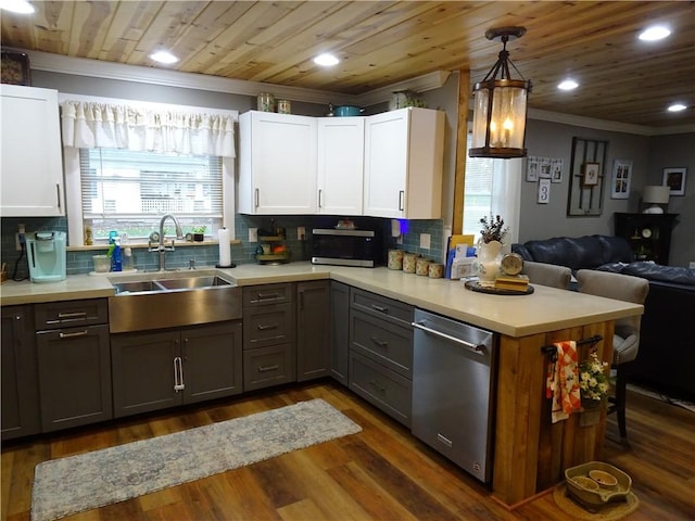 kitchen featuring stainless steel dishwasher, sink, decorative light fixtures, white cabinets, and gray cabinets