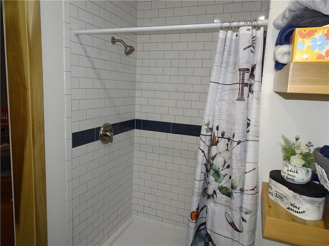 bathroom with a shower with shower curtain