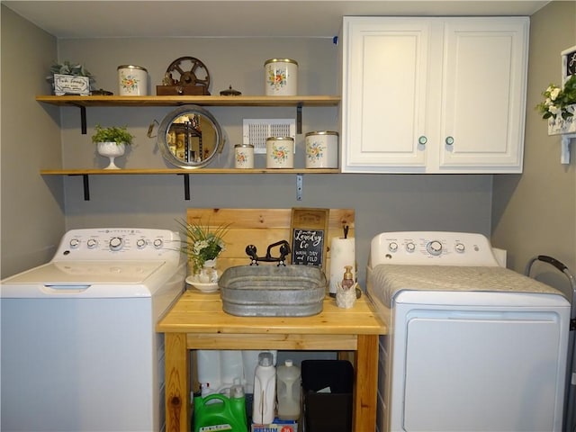 laundry room with separate washer and dryer