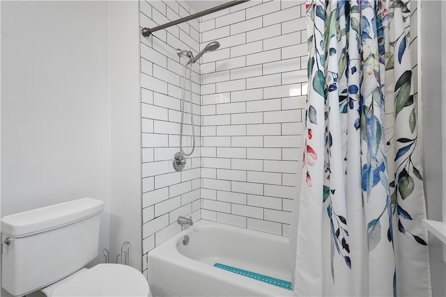 bathroom featuring toilet and shower / bath combo with shower curtain