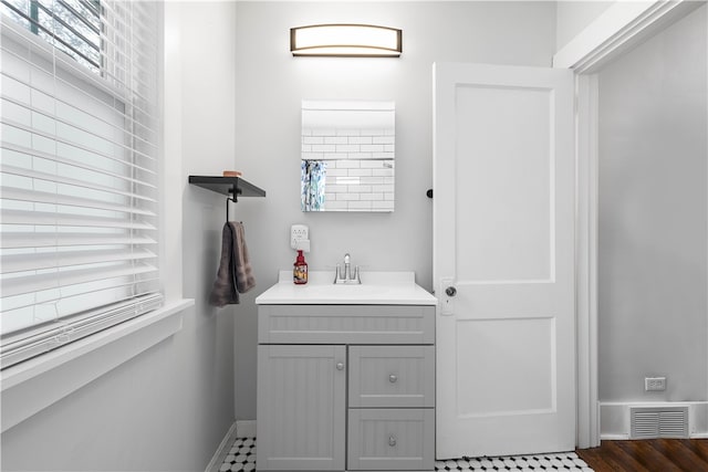 bathroom featuring wood-type flooring and vanity