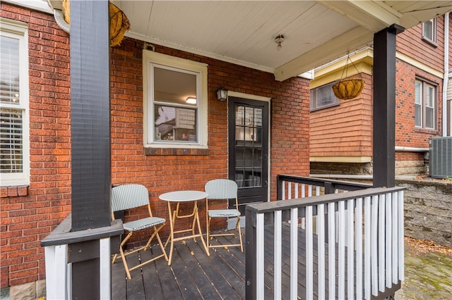 wooden deck with central air condition unit