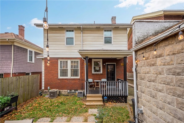 exterior space featuring central AC unit and a porch