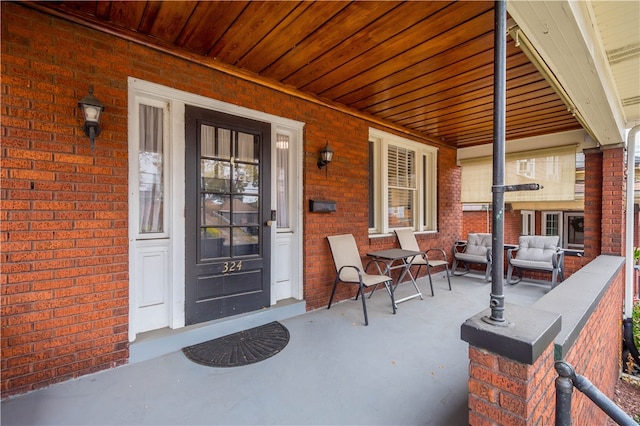 doorway to property with a porch