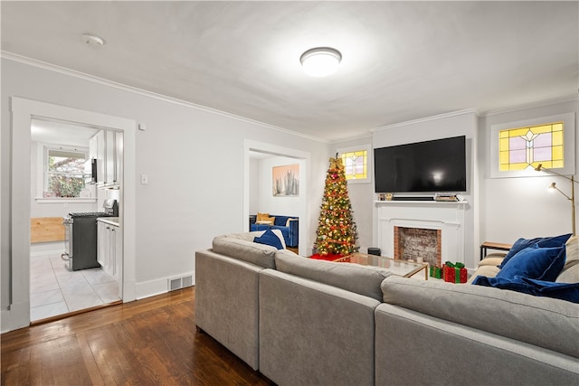 living room with hardwood / wood-style floors and ornamental molding