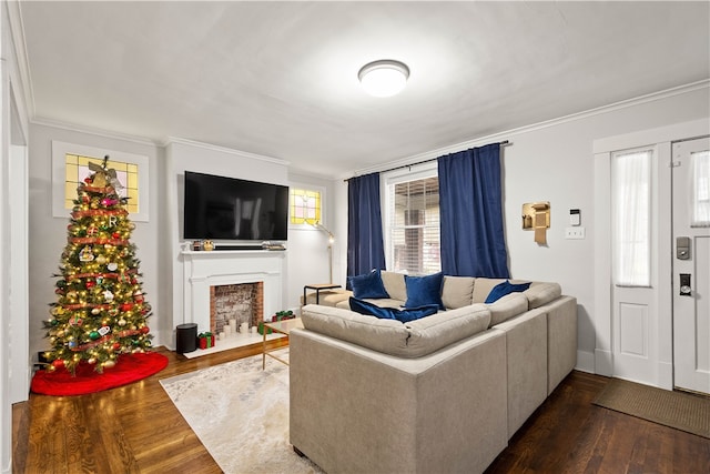 living room with dark hardwood / wood-style flooring and crown molding