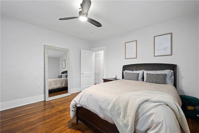 bedroom featuring ceiling fan and dark hardwood / wood-style floors