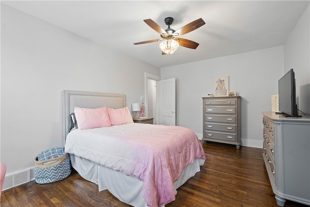 bedroom with ceiling fan and dark wood-type flooring