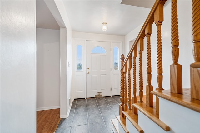 foyer entrance with dark hardwood / wood-style flooring