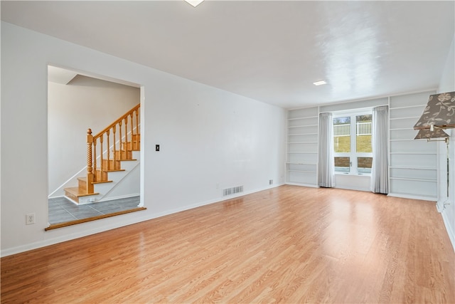 unfurnished living room with light hardwood / wood-style floors