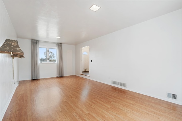 unfurnished room featuring light hardwood / wood-style flooring