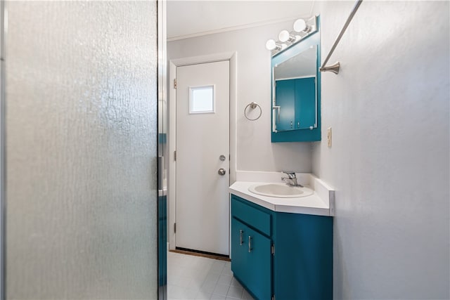 bathroom with tile patterned flooring and vanity