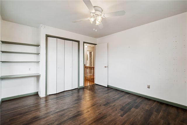 unfurnished bedroom featuring a closet, dark hardwood / wood-style floors, and ceiling fan