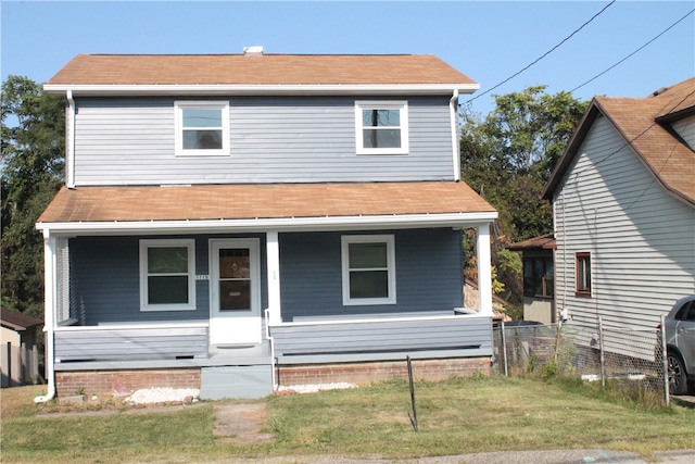 view of front of home featuring a porch and a front lawn