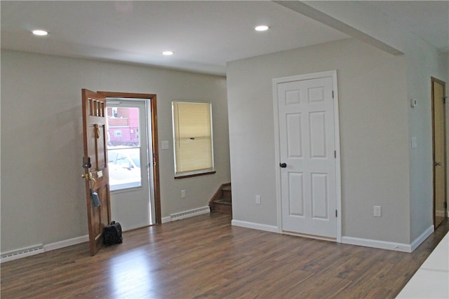 spare room with dark wood-type flooring