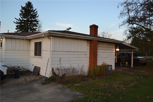 view of property exterior with a yard