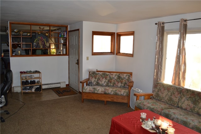 carpeted living room featuring baseboard heating and plenty of natural light