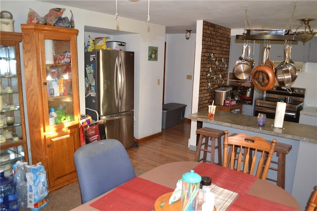 dining space featuring light wood-type flooring