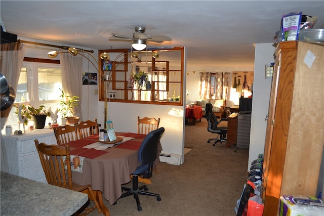 dining room featuring ceiling fan and carpet