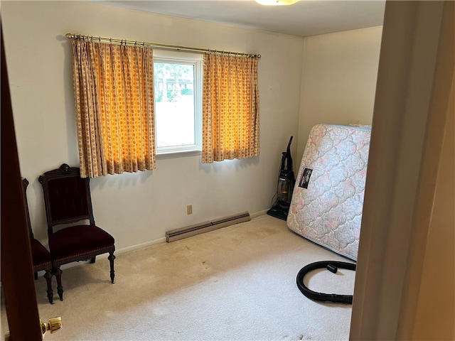 living area with carpet floors and a baseboard radiator