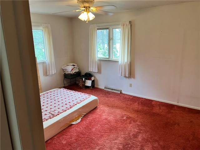 bedroom featuring carpet, ceiling fan, and a baseboard radiator