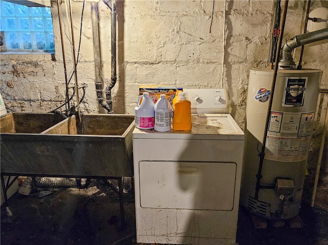 washroom with washing machine and dryer and water heater