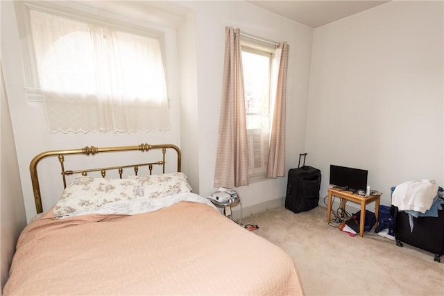 bedroom with light colored carpet