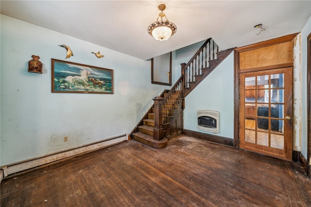 unfurnished living room featuring a baseboard heating unit, heating unit, and dark wood-type flooring