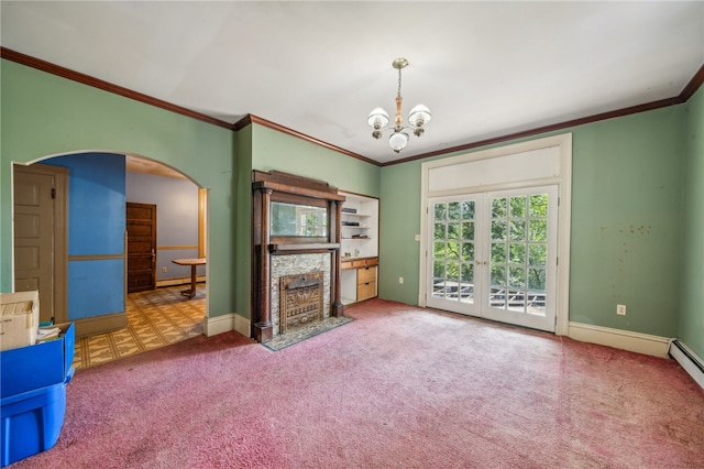 unfurnished living room featuring a chandelier, carpet flooring, and ornamental molding