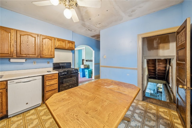 kitchen with dishwasher, black gas range oven, and ceiling fan